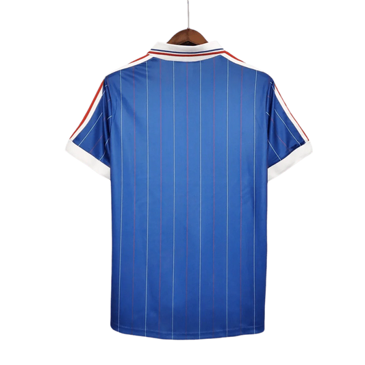 https://cdn.shopify.com/s/files/1/0826/7228/8075/files/19821983-france-home-retro-jersey-671265.webp?v=1741198521