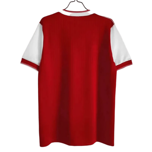https://cdn.shopify.com/s/files/1/0826/7228/8075/files/19841985-arsenal-home-retro-kit-classickits433-855881.webp?v=1741198341