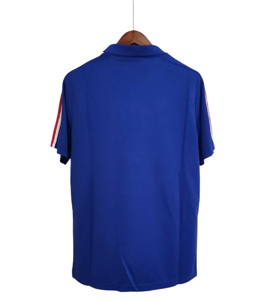 https://cdn.shopify.com/s/files/1/0826/7228/8075/files/19841985-france-home-retro-jersey-879948.webp?v=1741198517