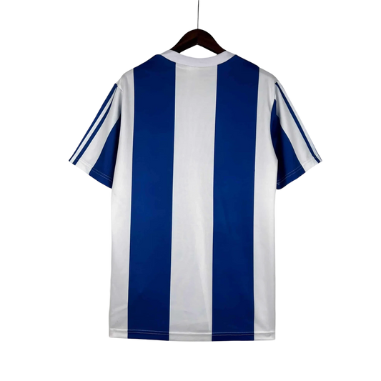 https://cdn.shopify.com/s/files/1/0826/7228/8075/files/19901993-fc-porto-revigres-away-retro-jersey-865502.webp?v=1741199358
