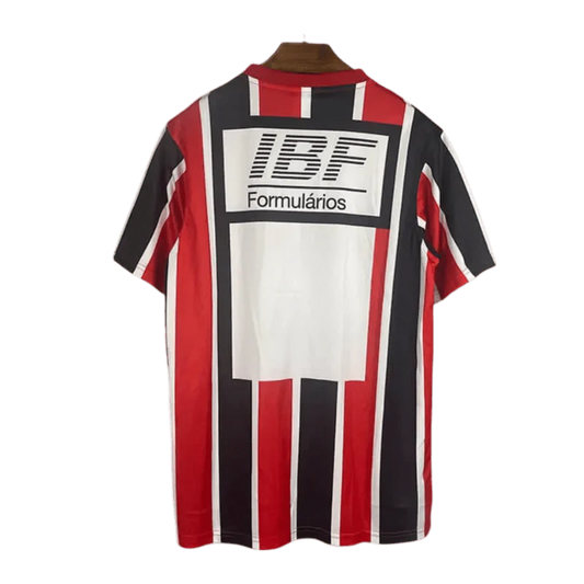 https://cdn.shopify.com/s/files/1/0826/7228/8075/files/19911992-sao-paulo-ibf-formularios-away-retro-jersey-334641.webp?v=1741197155