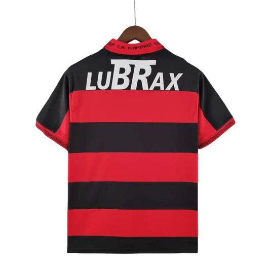 https://cdn.shopify.com/s/files/1/0826/7228/8075/files/19921993-flamengo-lubrax-home-retro-jersey-786395.webp?v=1741197155