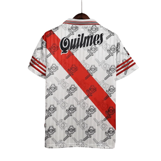 https://cdn.shopify.com/s/files/1/0826/7228/8075/files/19951996-river-plate-quilmes-home-retro-jersey-823538.webp?v=1741197179
