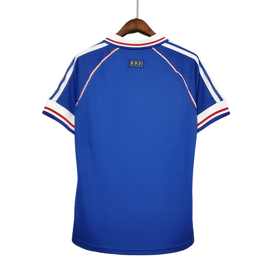https://cdn.shopify.com/s/files/1/0826/7228/8075/files/1998-france-world-cup-home-retro-jersey-405397.webp?v=1741198761