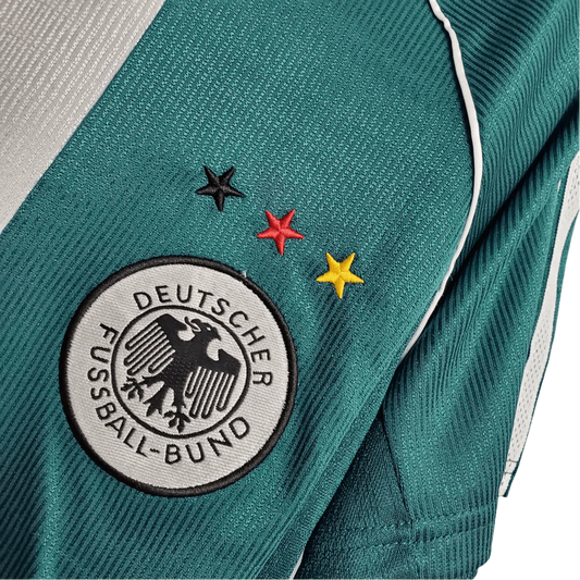 https://cdn.shopify.com/s/files/1/0826/7228/8075/files/1998-germany-away-retro-kit-640905.webp?v=1741197028