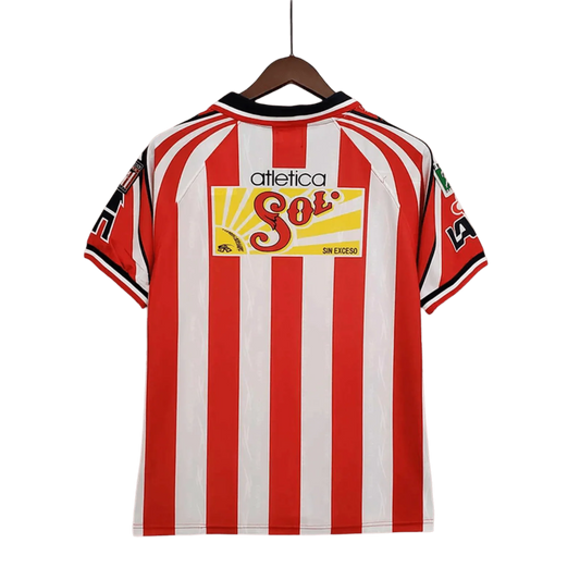 https://cdn.shopify.com/s/files/1/0826/7228/8075/files/19981999-chivas-guadalajara-coca-cola-home-retro-jersey-669504.webp?v=1741197190