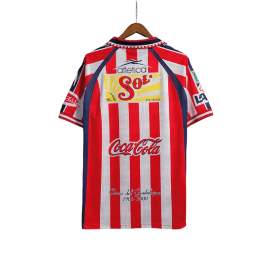 https://cdn.shopify.com/s/files/1/0826/7228/8075/files/19992000-chivas-guadalajara-cemento-tolteca-home-retro-jersey-348408.webp?v=1741197177