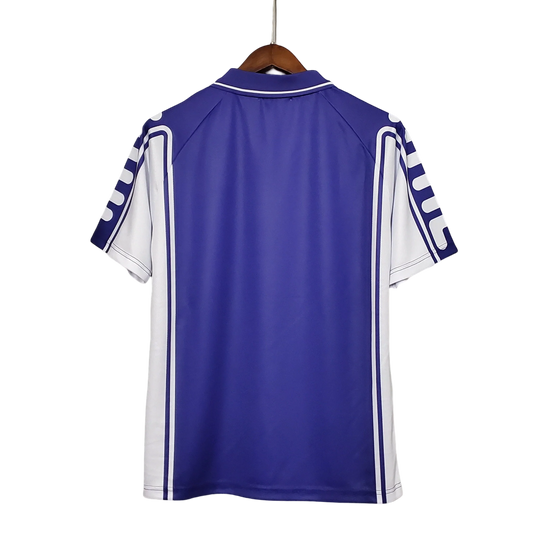 https://cdn.shopify.com/s/files/1/0826/7228/8075/files/19992000-fiorentina-florence-toyota-fila-home-retro-kit-classickits433-547770.webp?v=1741199030