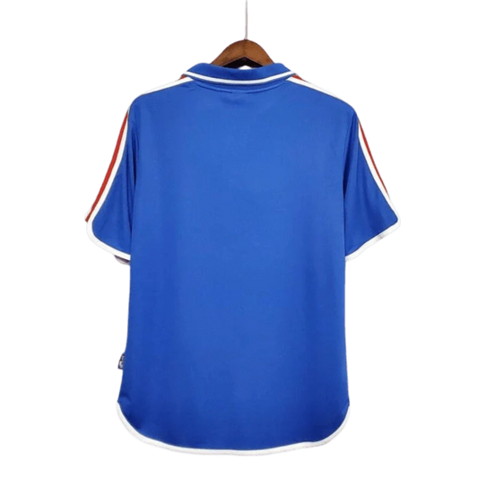 https://cdn.shopify.com/s/files/1/0826/7228/8075/files/20002001-france-home-retro-jersey-262261.webp?v=1741198520