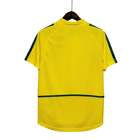 https://cdn.shopify.com/s/files/1/0826/7228/8075/files/2002-brazil-world-cup-home-retro-kit-classickits433-331500.webp?v=1741198809