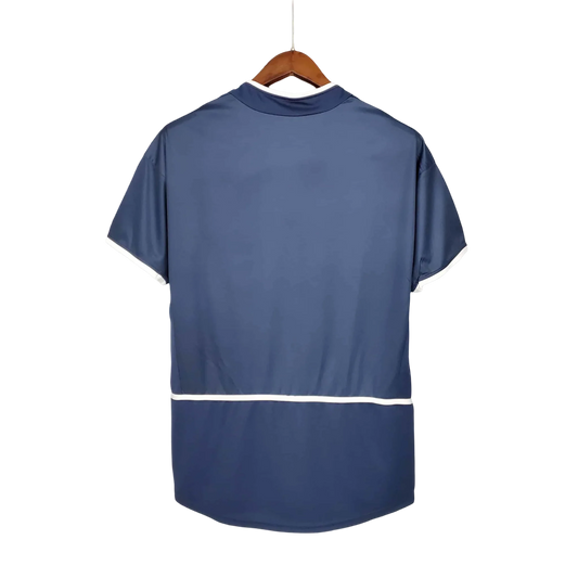 https://cdn.shopify.com/s/files/1/0826/7228/8075/files/20022003-paris-saint-germain-thomson-home-retro-jersey-546240.webp?v=1741199393