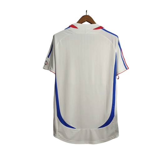 https://cdn.shopify.com/s/files/1/0826/7228/8075/files/2006-france-world-cup-away-retro-jersey-514548.webp?v=1741198593
