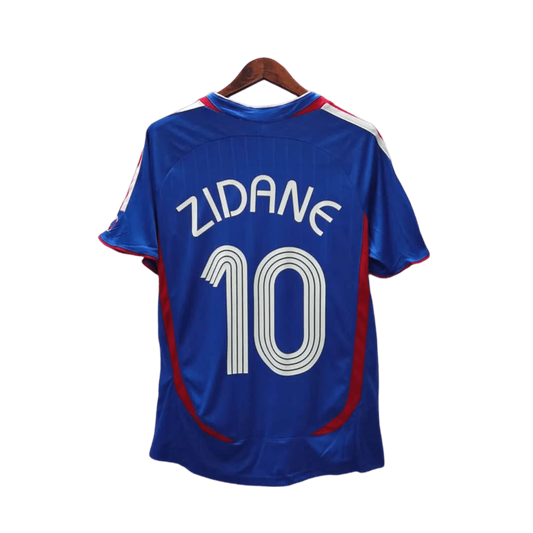 https://cdn.shopify.com/s/files/1/0826/7228/8075/files/2006-france-world-cup-home-retro-jersey-235085.webp?v=1741198514