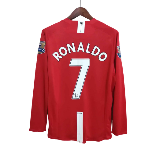 https://cdn.shopify.com/s/files/1/0826/7228/8075/files/20072008-manchester-united-aig-home-retro-kit-long-sleeve-classickits433-271468.webp?v=1741197740