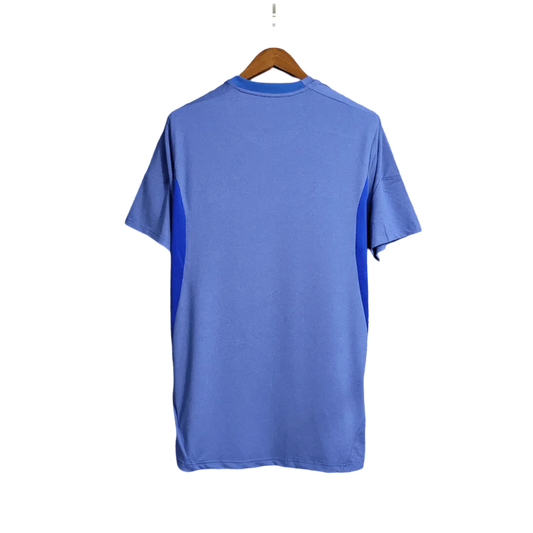https://cdn.shopify.com/s/files/1/0826/7228/8075/files/20132014-real-madrid-fly-emirates-away-retro-kit-258600.webp?v=1741197456