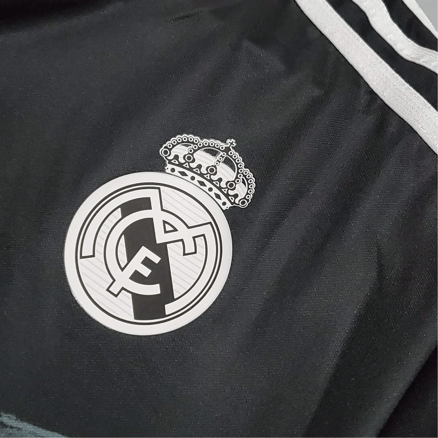 https://cdn.shopify.com/s/files/1/0826/7228/8075/files/20142015-real-madrid-fly-emirates-third-retro-kit-short-sleeves-676248.webp?v=1741197485