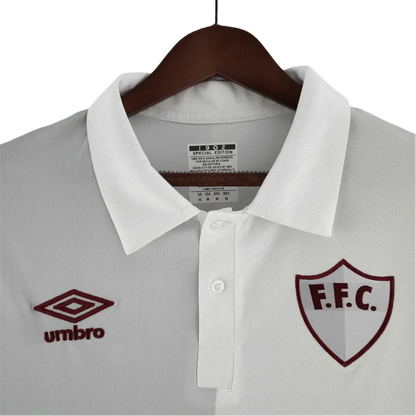 https://cdn.shopify.com/s/files/1/0826/7228/8075/files/120th-anniversary-fluminense-betano-white-grey-retro-kit-508946.webp?v=1741197184