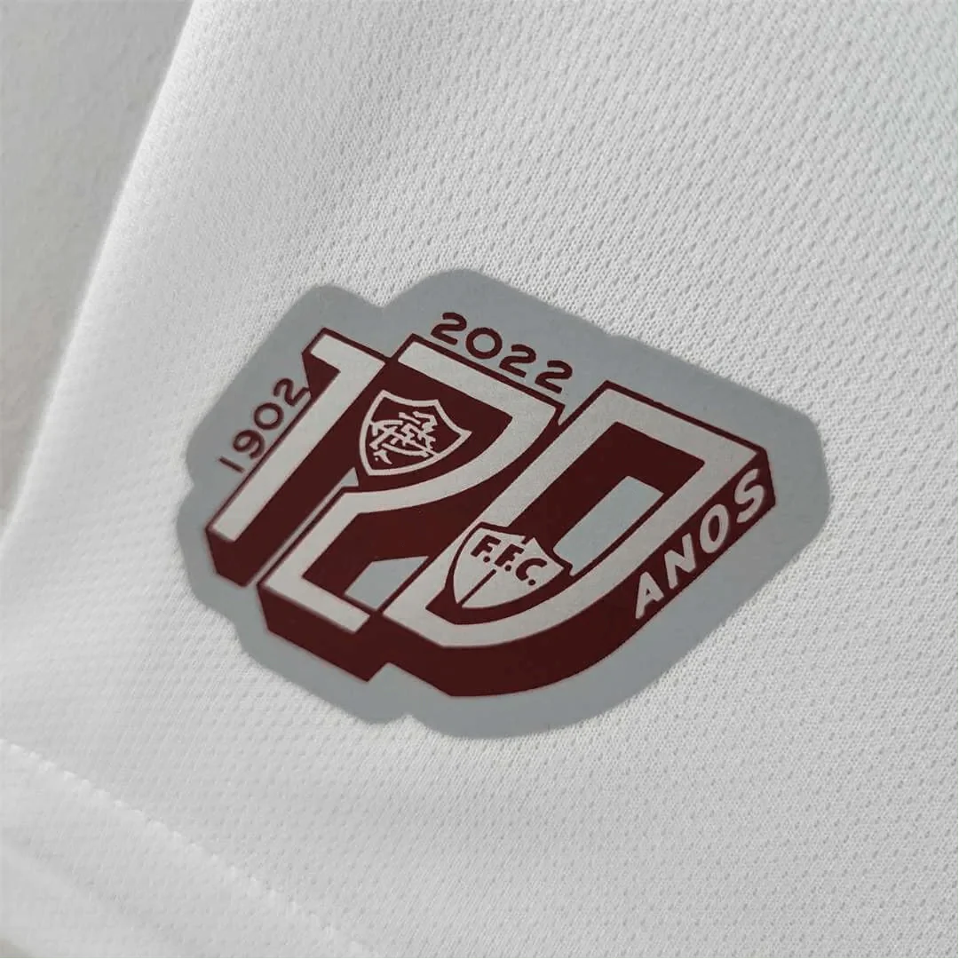 https://cdn.shopify.com/s/files/1/0826/7228/8075/files/120th-anniversary-fluminense-betano-white-grey-retro-kit-586447.webp?v=1741197187