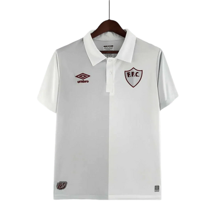 https://cdn.shopify.com/s/files/1/0826/7228/8075/files/120th-anniversary-fluminense-betano-white-grey-retro-kit-588435.webp?v=1741197290