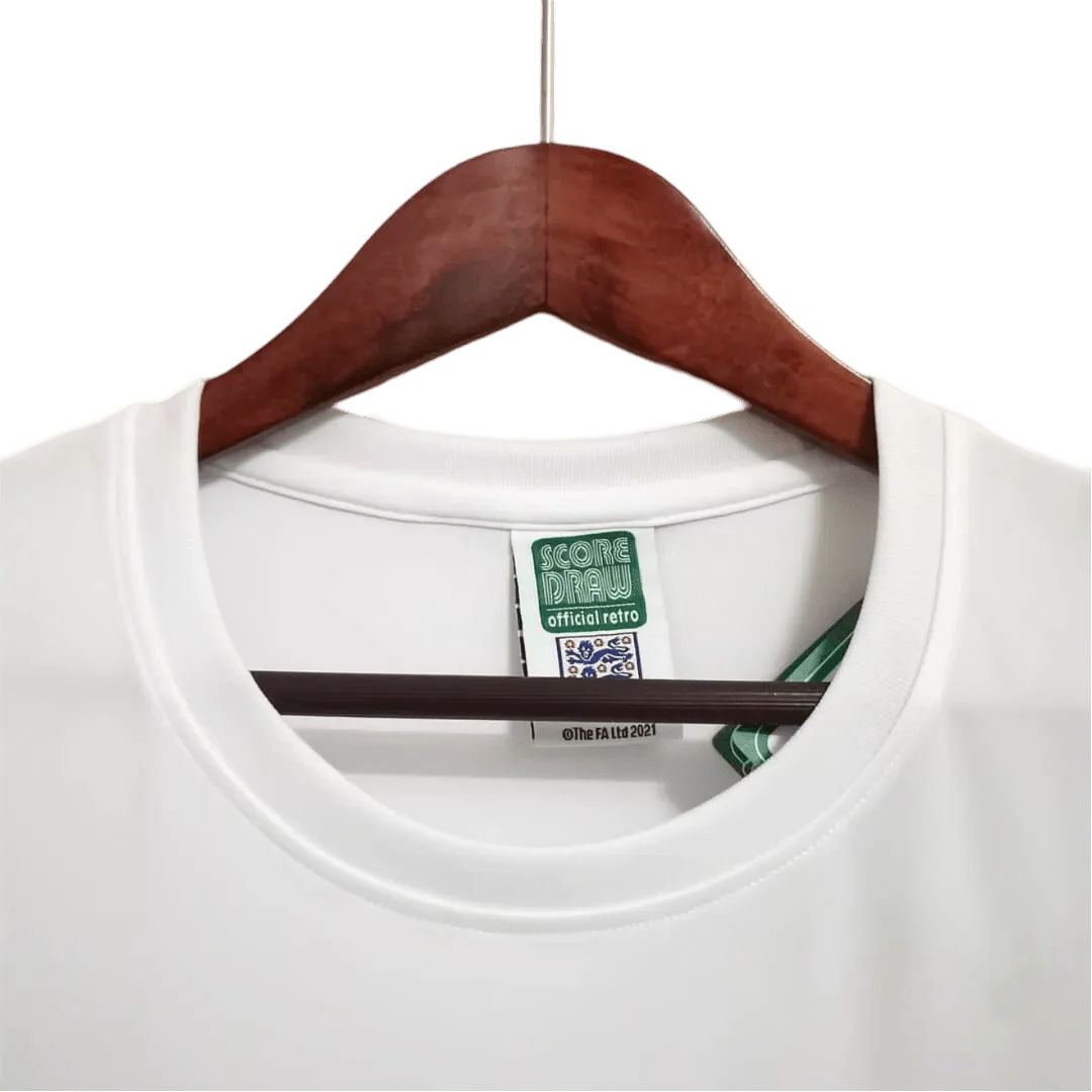 https://cdn.shopify.com/s/files/1/0826/7228/8075/files/1966-england-home-retro-kit-384327.webp?v=1741196957