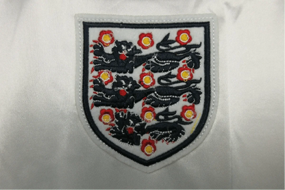 https://cdn.shopify.com/s/files/1/0826/7228/8075/files/1980-england-home-retro-kit-390905.webp?v=1741196942