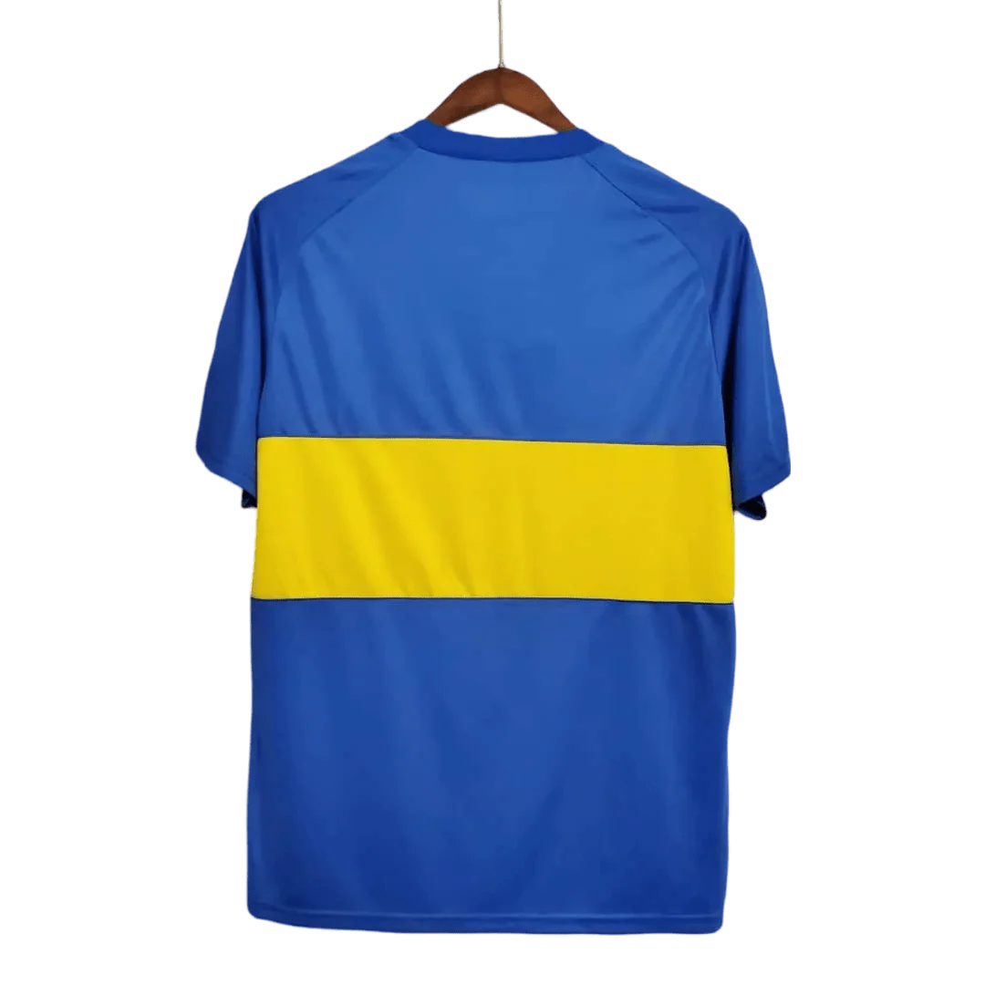 https://cdn.shopify.com/s/files/1/0826/7228/8075/files/19811982-boca-juniors-home-retro-jersey-351287.webp?v=1741197156