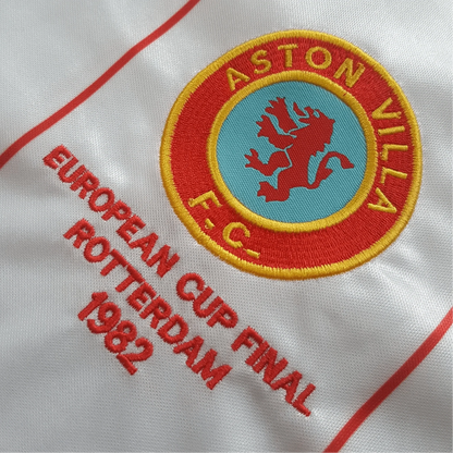 https://cdn.shopify.com/s/files/1/0826/7228/8075/files/19821983-aston-villa-away-retro-kit-classickits433-509092.webp?v=1741198343
