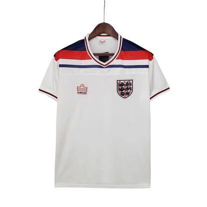 https://cdn.shopify.com/s/files/1/0826/7228/8075/files/19821983-england-home-retro-kit-classickits433-210937.webp?v=1741198464