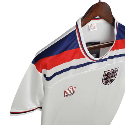 https://cdn.shopify.com/s/files/1/0826/7228/8075/files/19821983-england-home-retro-kit-classickits433-721761.webp?v=1741198463
