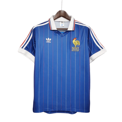 https://cdn.shopify.com/s/files/1/0826/7228/8075/files/19821983-france-home-retro-jersey-954765.webp?v=1741198521