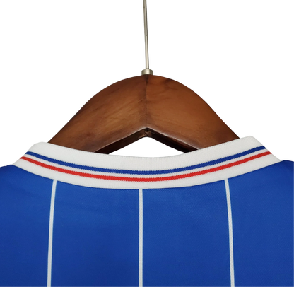 https://cdn.shopify.com/s/files/1/0826/7228/8075/files/19821983-glasgow-rangers-home-kit-classickits433-294481.webp?v=1741199179