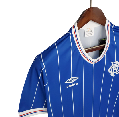 https://cdn.shopify.com/s/files/1/0826/7228/8075/files/19821983-glasgow-rangers-home-kit-classickits433-354631.webp?v=1741199179