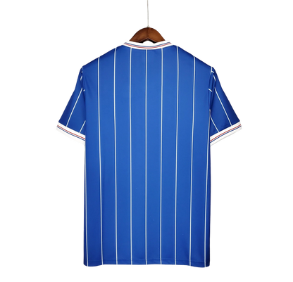 https://cdn.shopify.com/s/files/1/0826/7228/8075/files/19821983-glasgow-rangers-home-kit-classickits433-537152.webp?v=1741199179