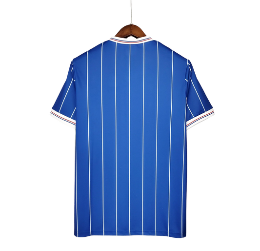 https://cdn.shopify.com/s/files/1/0826/7228/8075/files/19821983-glasgow-rangers-home-kit-classickits433-537152.webp?v=1741199179