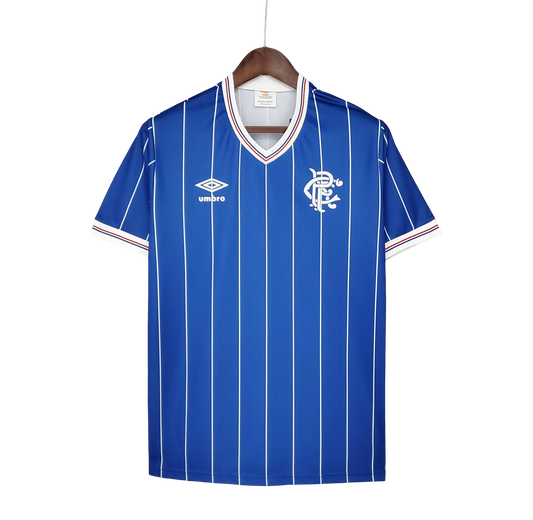 https://cdn.shopify.com/s/files/1/0826/7228/8075/files/19821983-glasgow-rangers-home-kit-classickits433-689095.webp?v=1741199181
