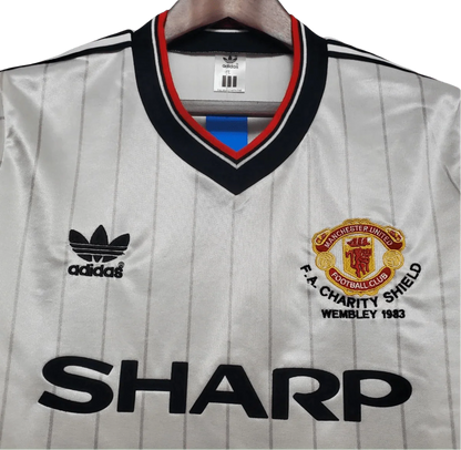 https://cdn.shopify.com/s/files/1/0826/7228/8075/files/19831984-manchester-united-sharp-fa-charity-shield-away-retro-kit-classickits433-236635.webp?v=1741199140