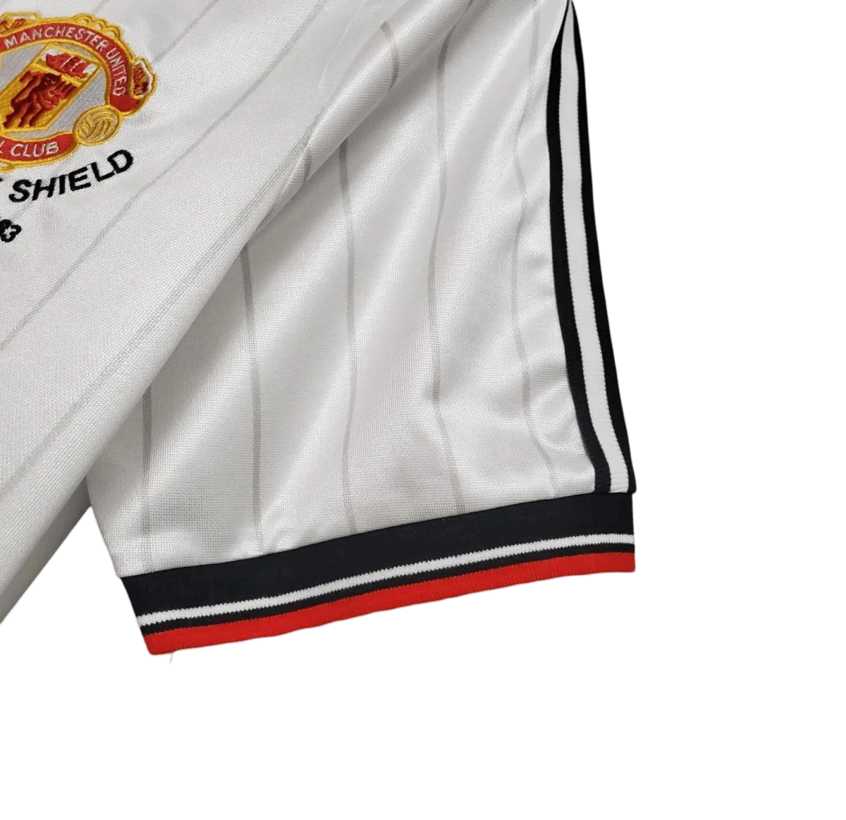 https://cdn.shopify.com/s/files/1/0826/7228/8075/files/19831984-manchester-united-sharp-fa-charity-shield-away-retro-kit-classickits433-994765.webp?v=1741199139