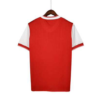 https://cdn.shopify.com/s/files/1/0826/7228/8075/files/19831986-arsenal-home-retro-kit-classickits433-609496.webp?v=1741199261