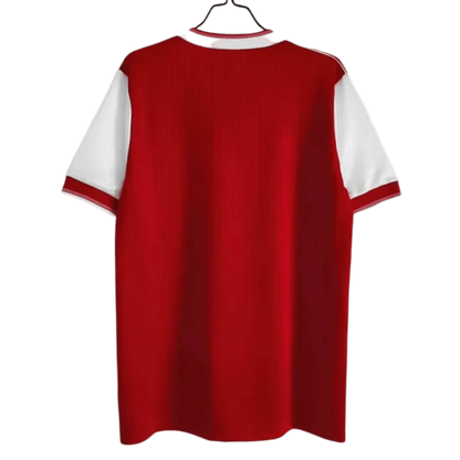 https://cdn.shopify.com/s/files/1/0826/7228/8075/files/19841985-arsenal-home-retro-kit-classickits433-855881.webp?v=1741198341
