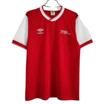 https://cdn.shopify.com/s/files/1/0826/7228/8075/files/19841985-arsenal-home-retro-kit-classickits433-865089.webp?v=1741198342