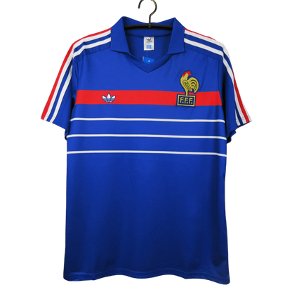 https://cdn.shopify.com/s/files/1/0826/7228/8075/files/19841985-france-home-retro-jersey-385913.webp?v=1741198515