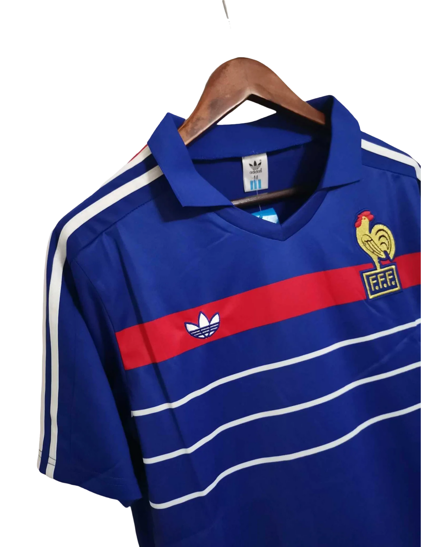 https://cdn.shopify.com/s/files/1/0826/7228/8075/files/19841985-france-home-retro-jersey-700529.webp?v=1741198514