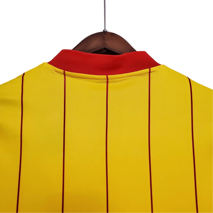 https://cdn.shopify.com/s/files/1/0826/7228/8075/files/19841985-liverpool-crown-paints-yellow-away-retro-kit-classickits433-251734.webp?v=1741199198
