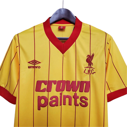 https://cdn.shopify.com/s/files/1/0826/7228/8075/files/19841985-liverpool-crown-paints-yellow-away-retro-kit-classickits433-322699.webp?v=1741199198