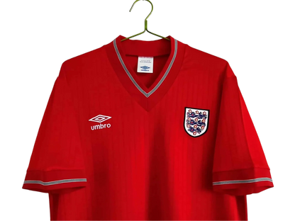 https://cdn.shopify.com/s/files/1/0826/7228/8075/files/19841987-england-away-red-retro-kit-503009.webp?v=1741196953