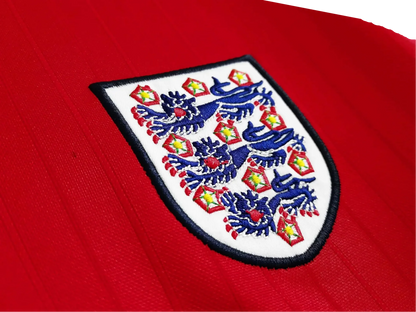 https://cdn.shopify.com/s/files/1/0826/7228/8075/files/19841987-england-away-red-retro-kit-766327.webp?v=1741196953