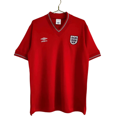 https://cdn.shopify.com/s/files/1/0826/7228/8075/files/19841987-england-away-red-retro-kit-890329.webp?v=1741196951