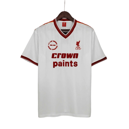 https://cdn.shopify.com/s/files/1/0826/7228/8075/files/19851986-liverpool-crown-paints-white-away-retro-kit-classickits433-585177.webp?v=1741199196