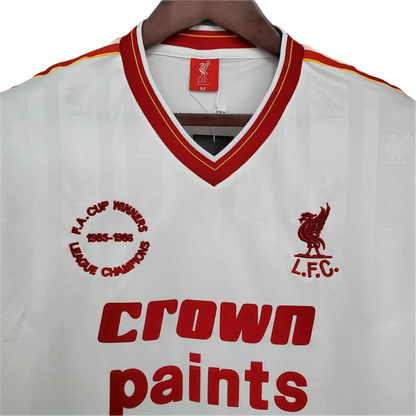 https://cdn.shopify.com/s/files/1/0826/7228/8075/files/19851986-liverpool-crown-paints-white-away-retro-kit-classickits433-666854.webp?v=1741199194