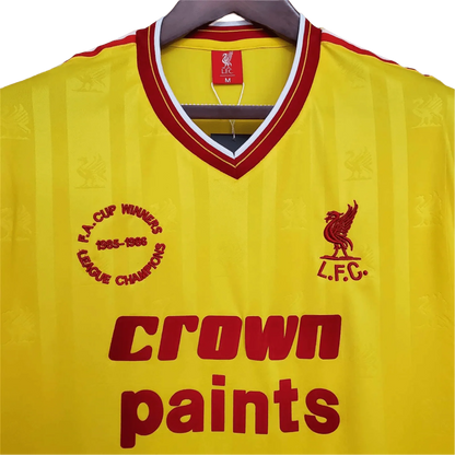 https://cdn.shopify.com/s/files/1/0826/7228/8075/files/19851986-liverpool-crown-paints-yellow-third-retro-kit-classickits433-561364.webp?v=1741197843